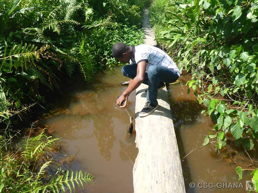 Victor checks out the almost murky waters of a stream
